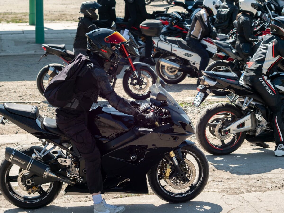 Motorcyclists gather for a group ride in Wrocław, showcasing various bikes and gear.